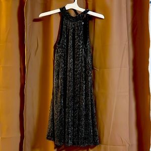 Like new, never worn, had tags. Halter top, with little opening in the back